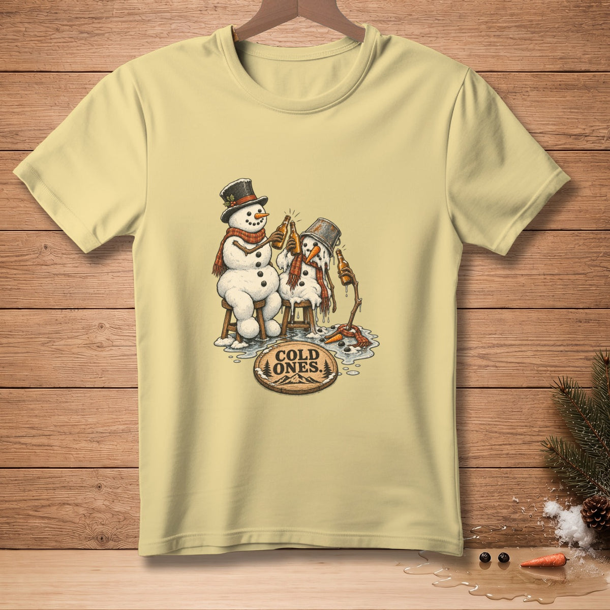 Light yellow t-shirt featuring two snowmen drinking beer with text "COLD ONES."