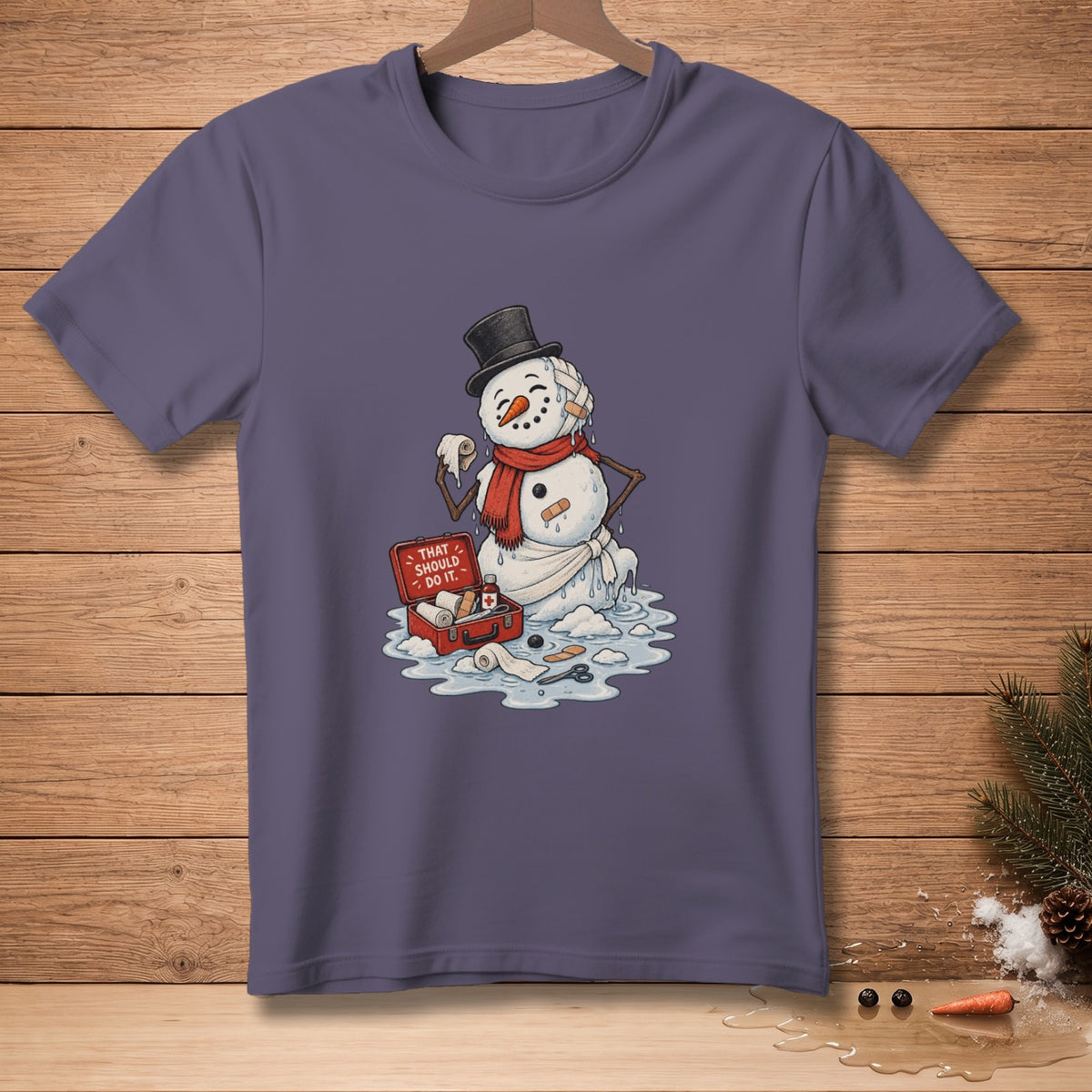 Snowman with bandages, melting, and a first-aid kit with text "THAT SHOULD DO IT."