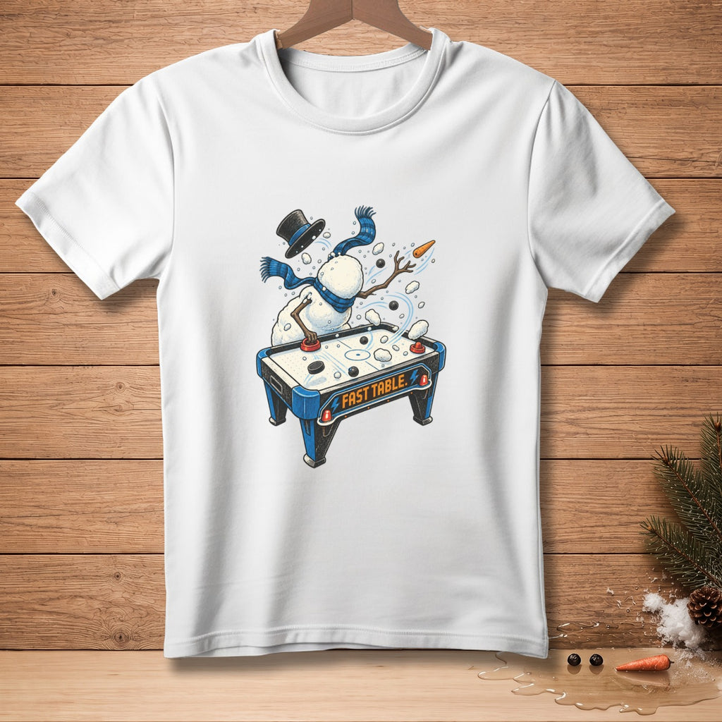 White t-shirt with snowman playing air hockey, reading "FAST TABLE".