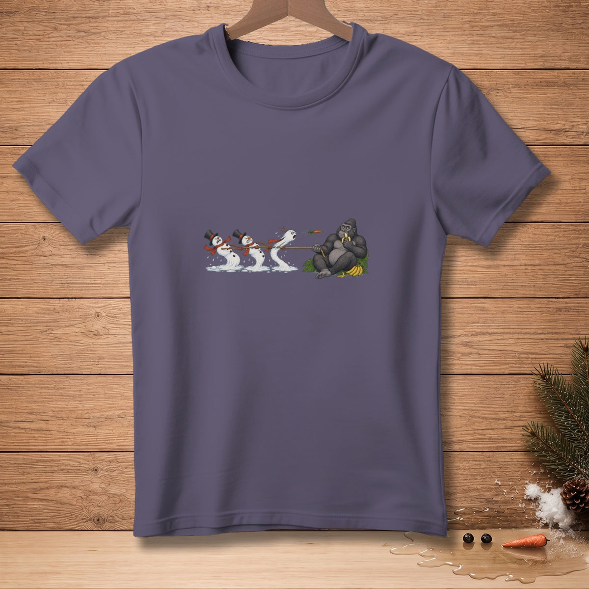 Gorilla eating banana pulls melting snowmen on a rope.