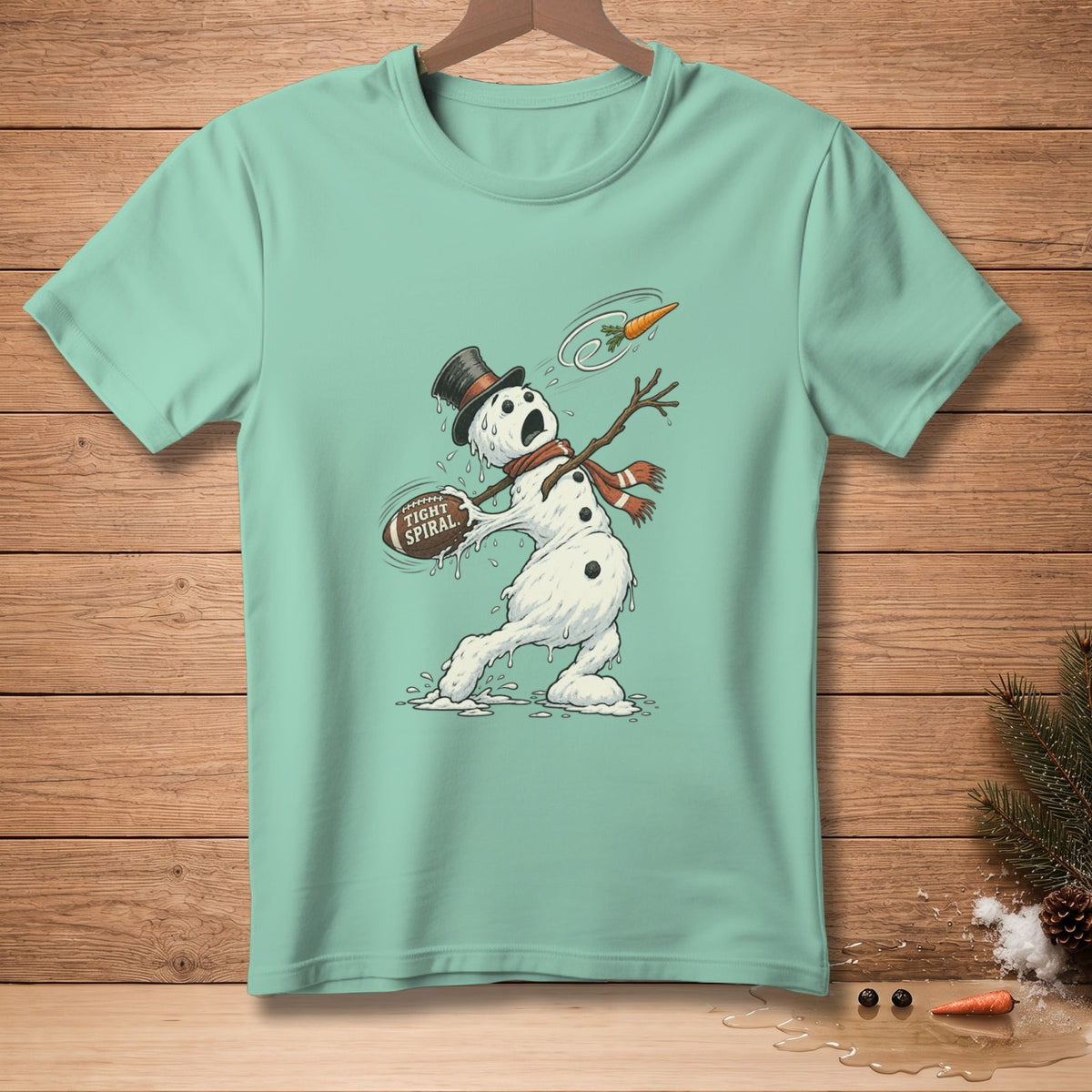 Melting snowman in top hat juggles football labeled "Tight Spiral" and a carrot.
