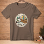 T-shirt featuring a melting snowman at a bar with cocktails, text "PLAYED IT SAFE."