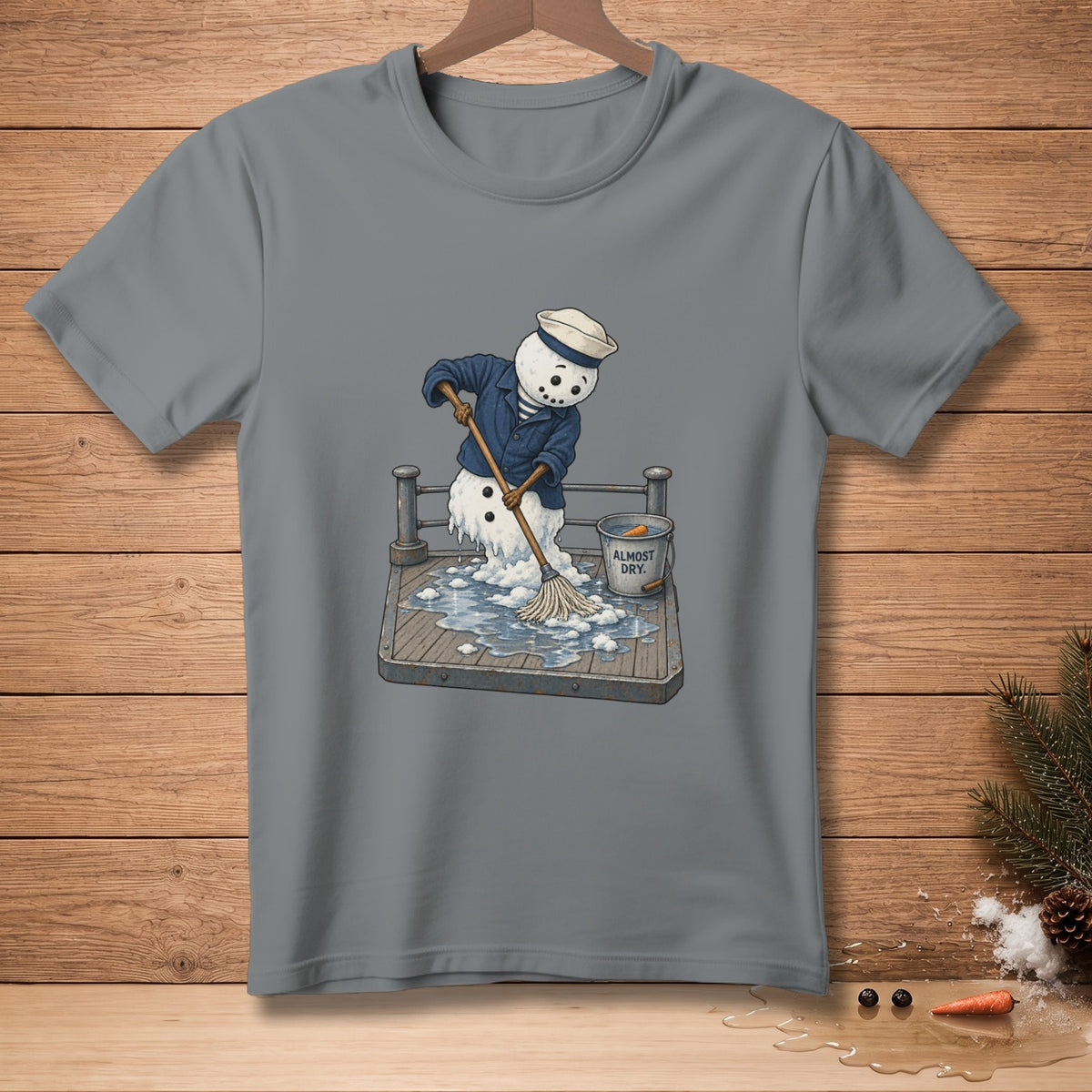 Melting snowman in sailor outfit mops up water with bucket labeled "ALMOST DRY."