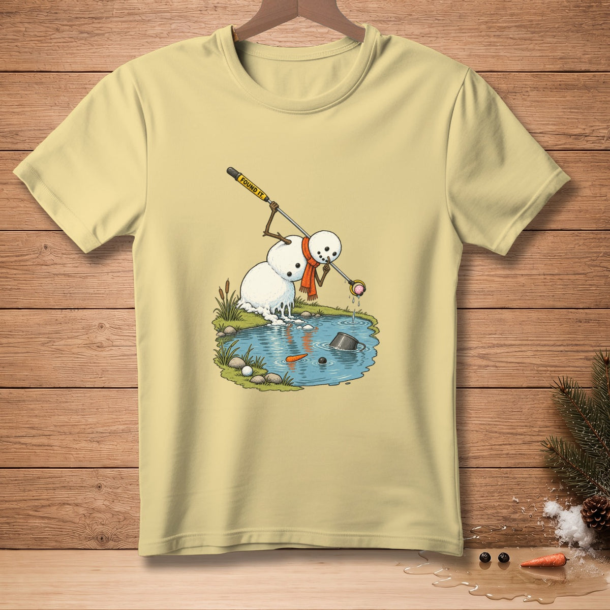 Snowman with orange scarf retrieving a ball from a pond with a club labeled "FOUND IT."