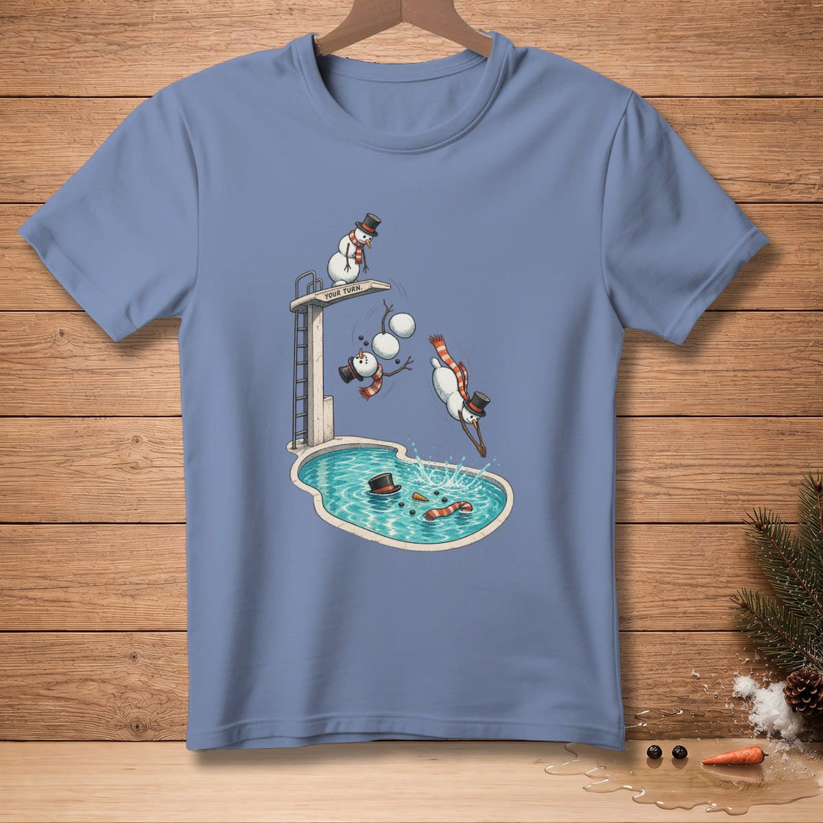 T-shirt with snowmen diving into a pool from a diving board that reads "Your Turn."