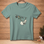 T-shirt with a distressed snowman on a clothesline with a hat, scarf, and carrot.