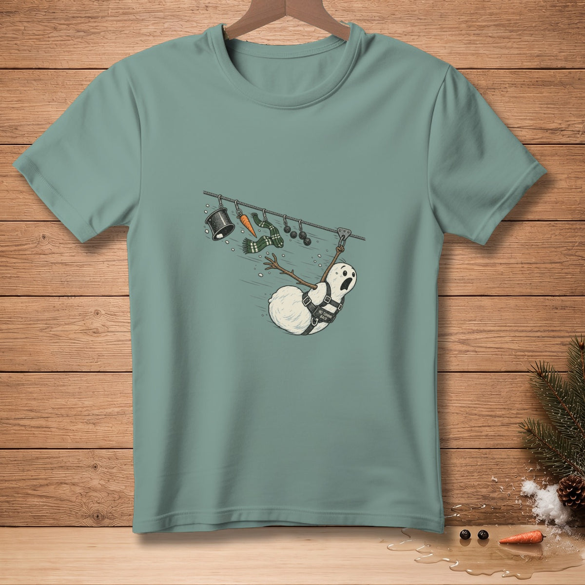T-shirt with a distressed snowman on a clothesline with a hat, scarf, and carrot.