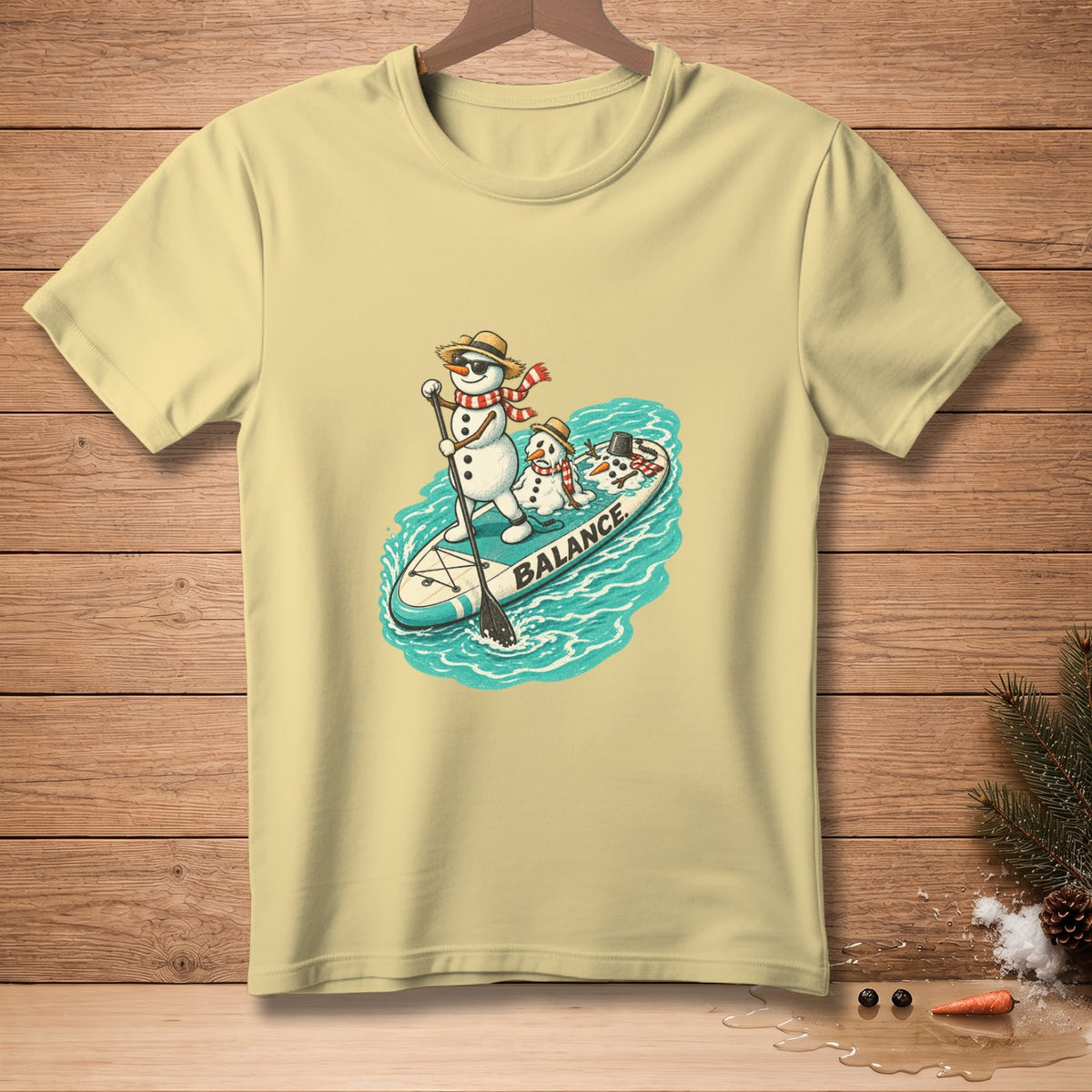 Two snowmen on a paddleboard with "BALANCE" text in water.