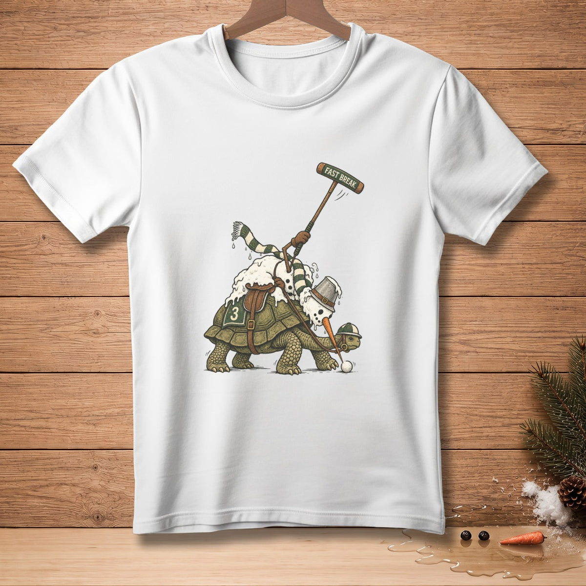 Snowman playing golf on a tortoise with "FAST BREAK" text on a white t-shirt.