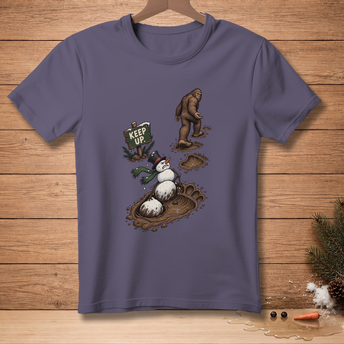 Bigfoot walks past a snowman stuck in mud next to a "Keep Up" sign.