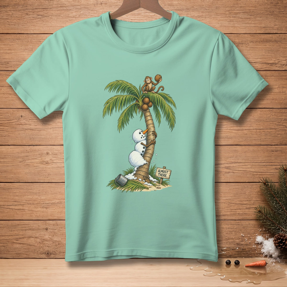 Cartoon of a monkey and snowmen on a palm tree with a sign that reads "Almost There."