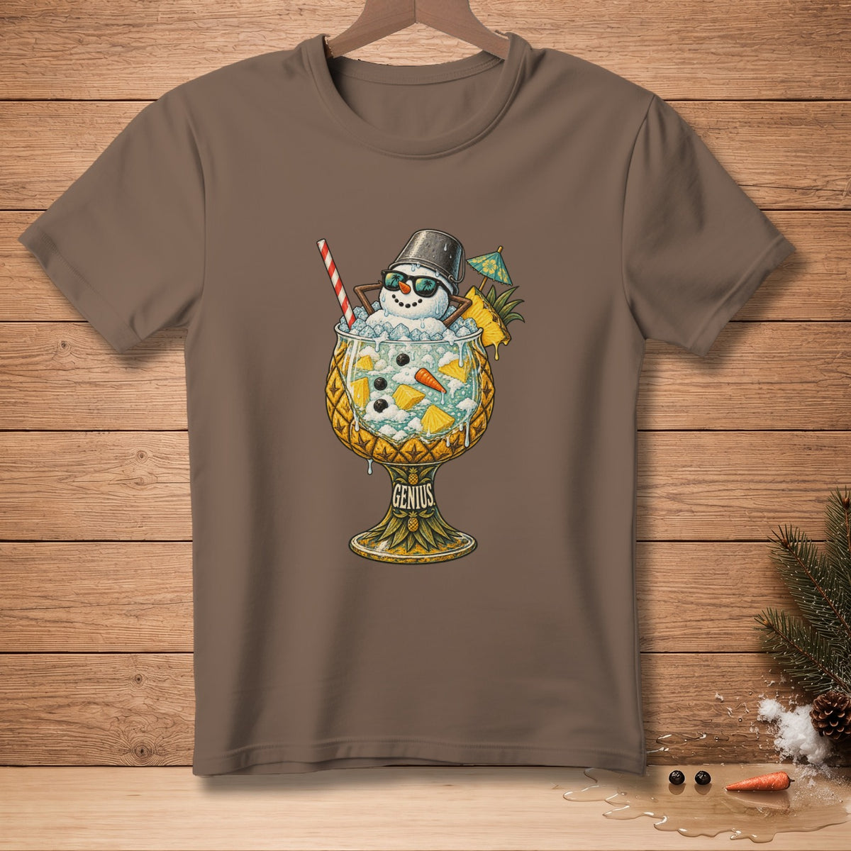 T-shirt graphic of a snowman in a pineapple cocktail glass with sunglasses and umbrella.
