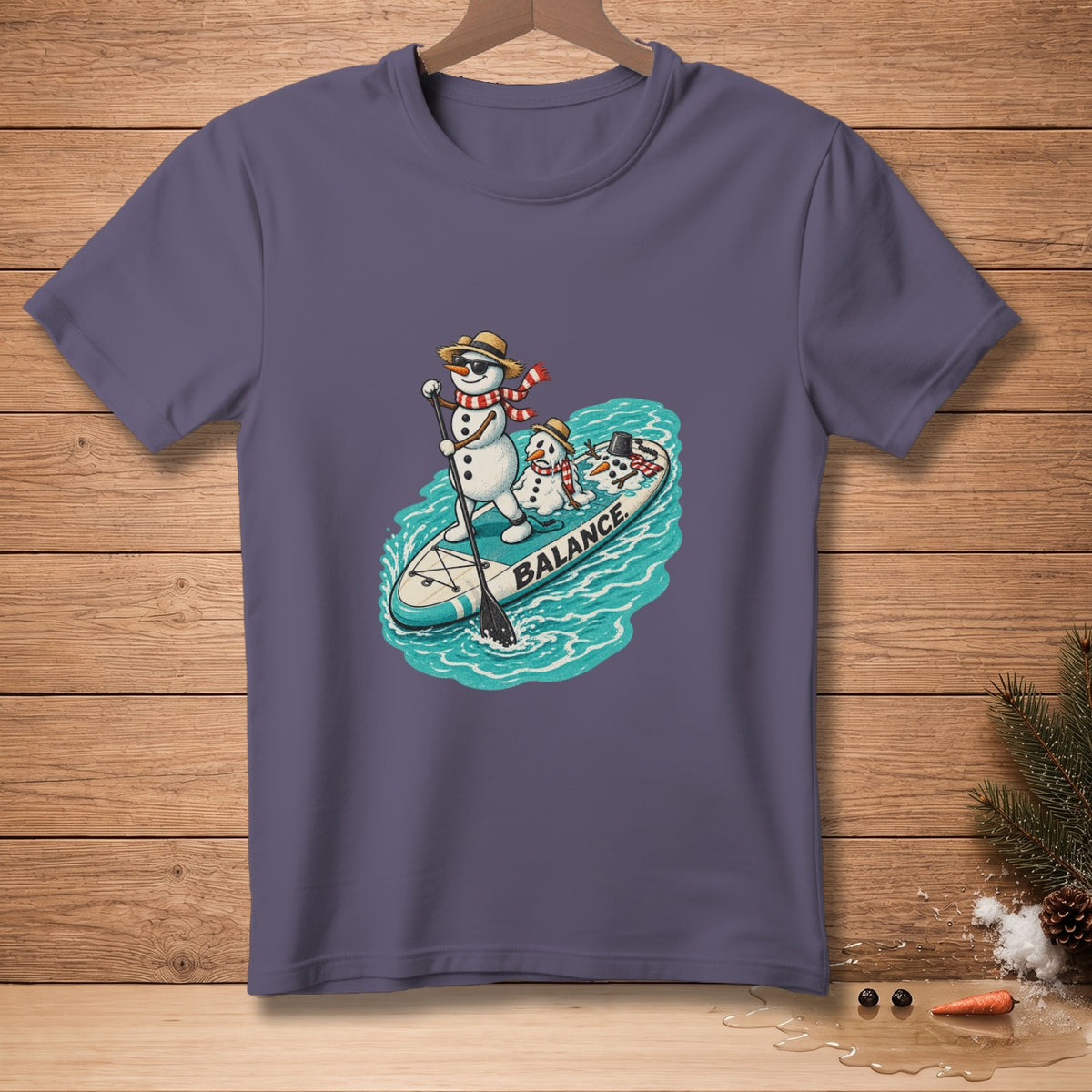 Two snowmen on a paddleboard with the word "BALANCE" printed on the board.