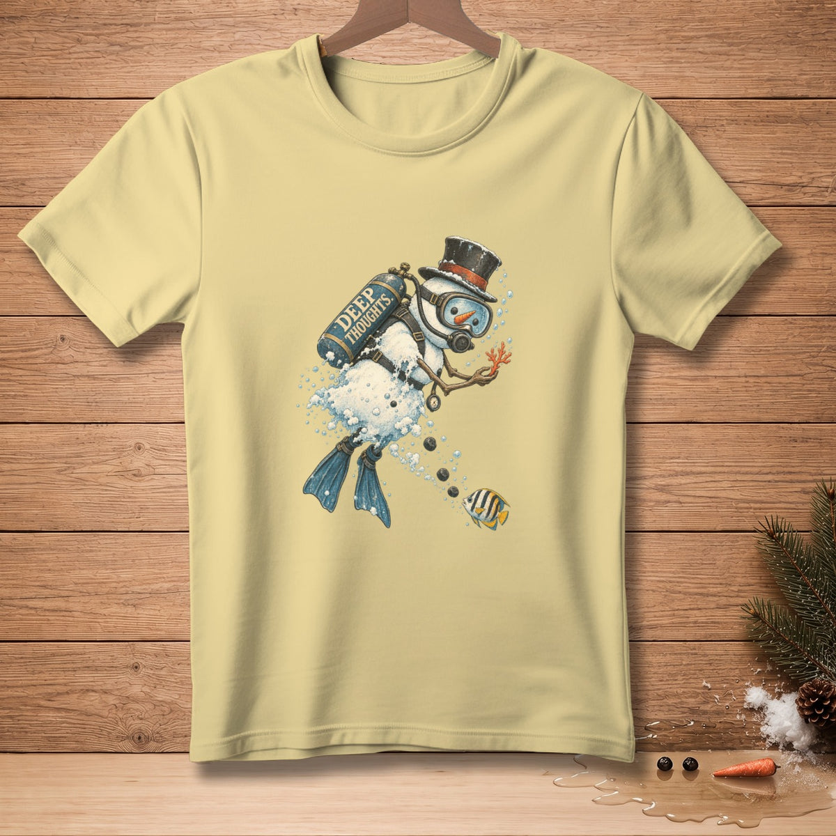 Pale yellow t-shirt with a graphic of a diving snowman with "Deep Thoughts" on tank.
