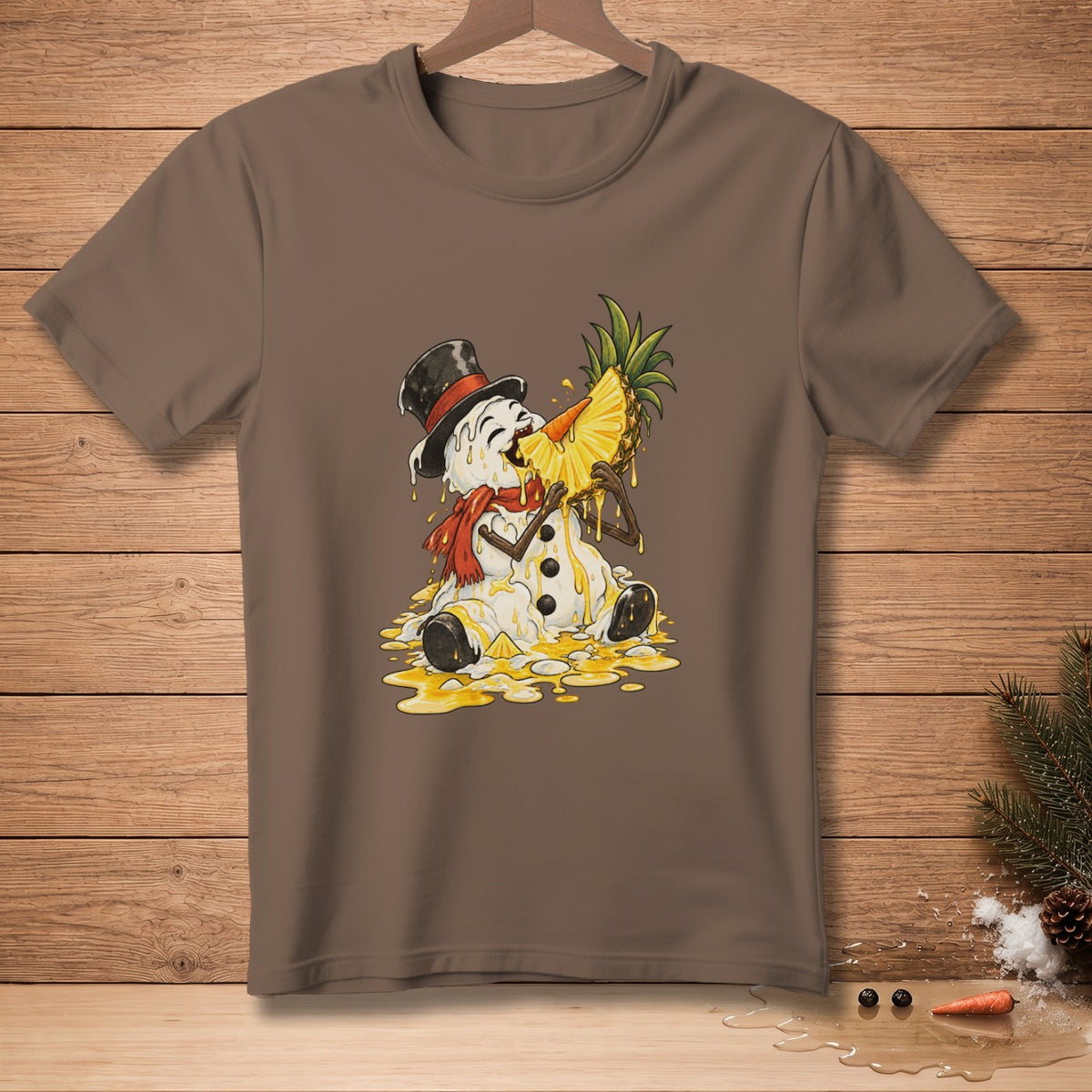 Melting snowman in top hat eating pineapple slice, graphic on brown t-shirt.