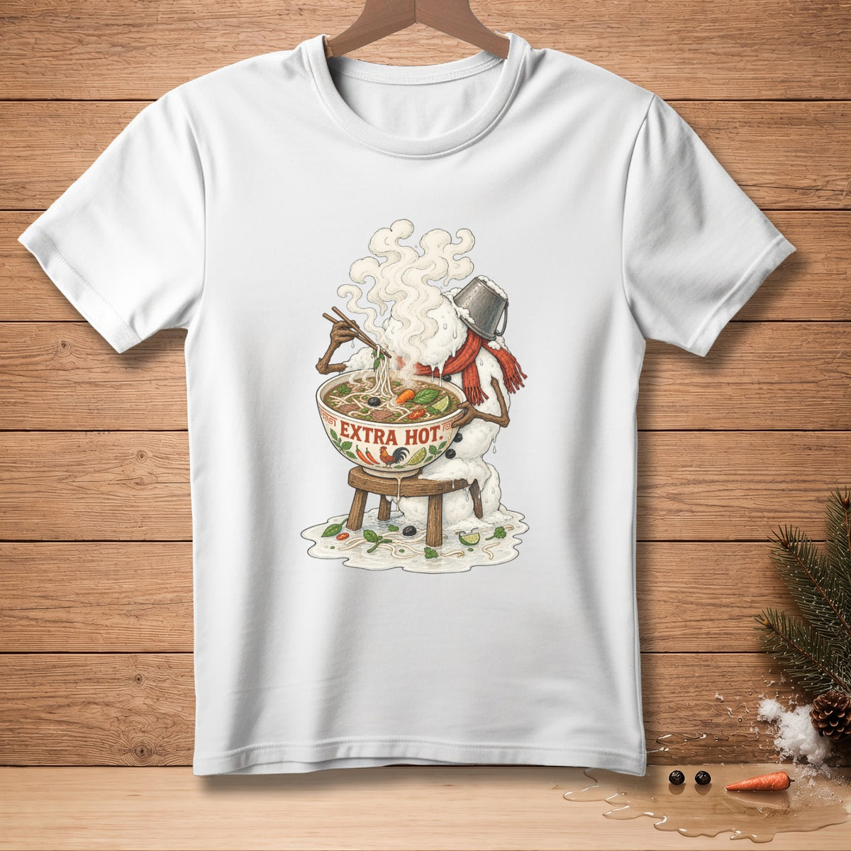 White t-shirt graphic of a snowman eating steaming pho with "EXTRA HOT." text.