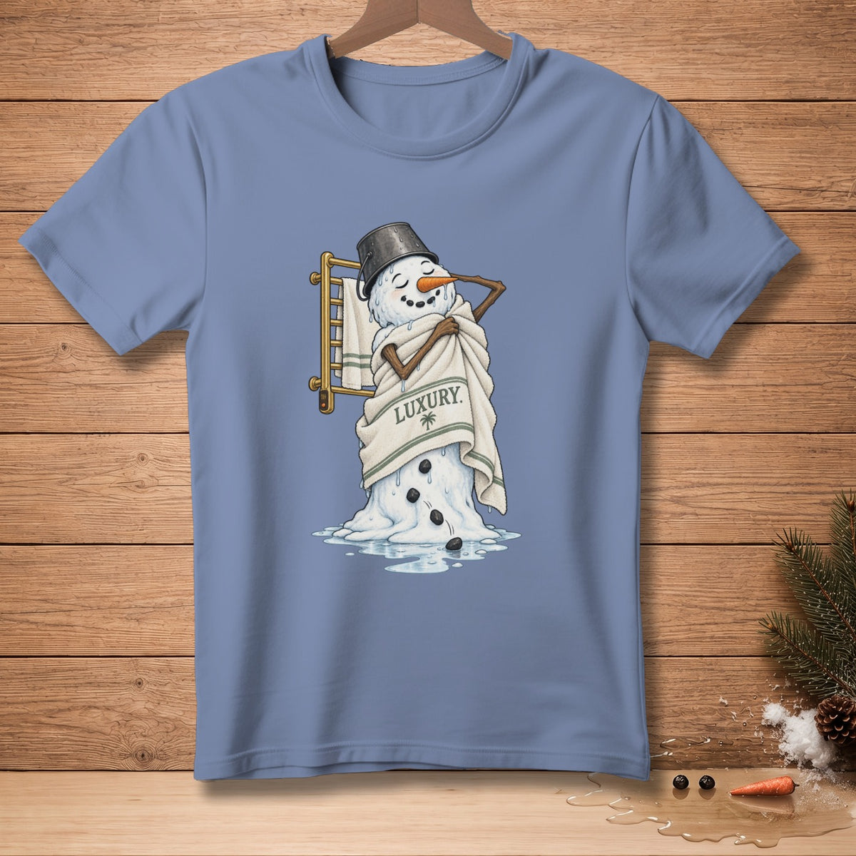 A melting snowman wrapped in a towel with the word "LUXURY" printed on it.