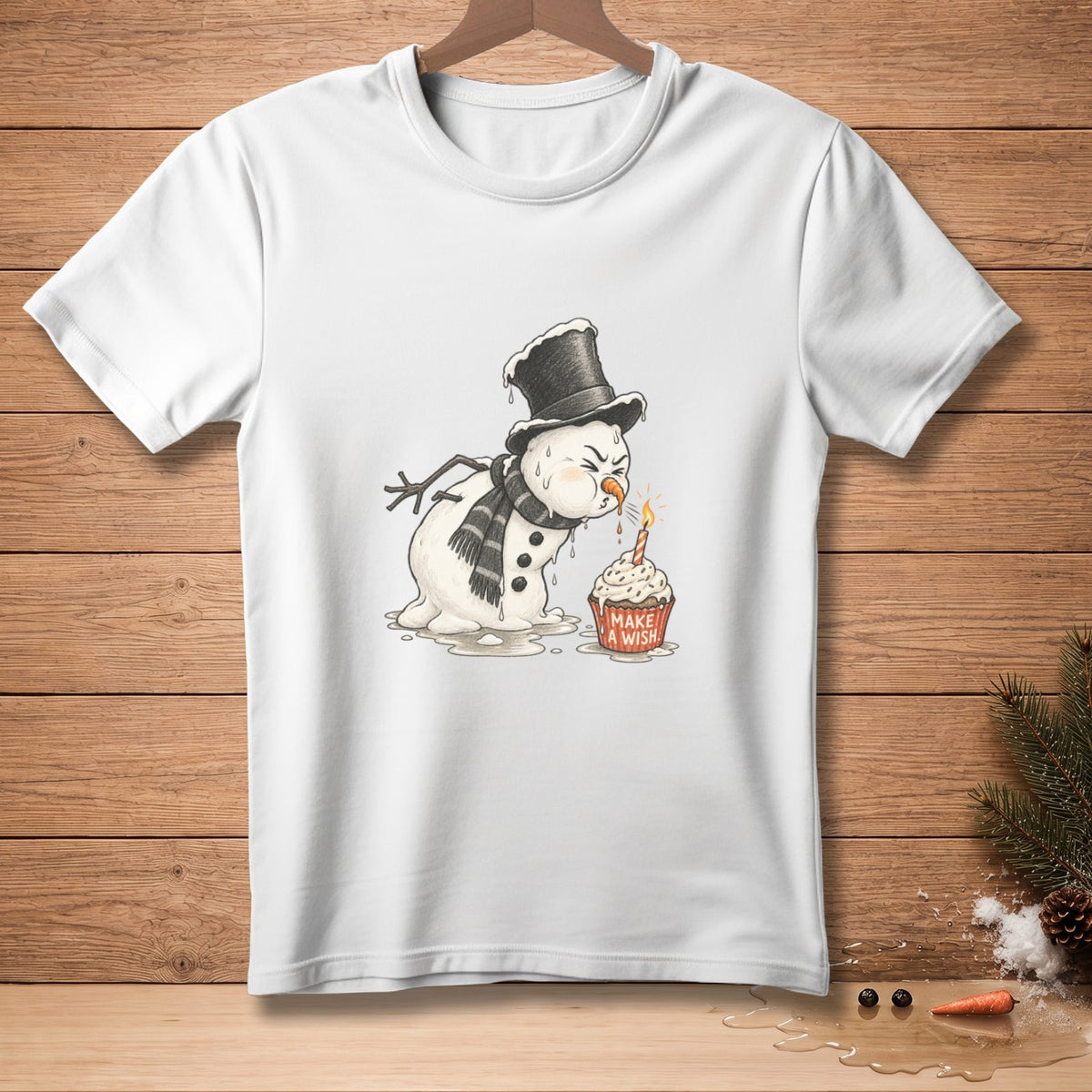 Melting snowman in top hat and scarf blows out birthday candle on cupcake with "Make a Wish".