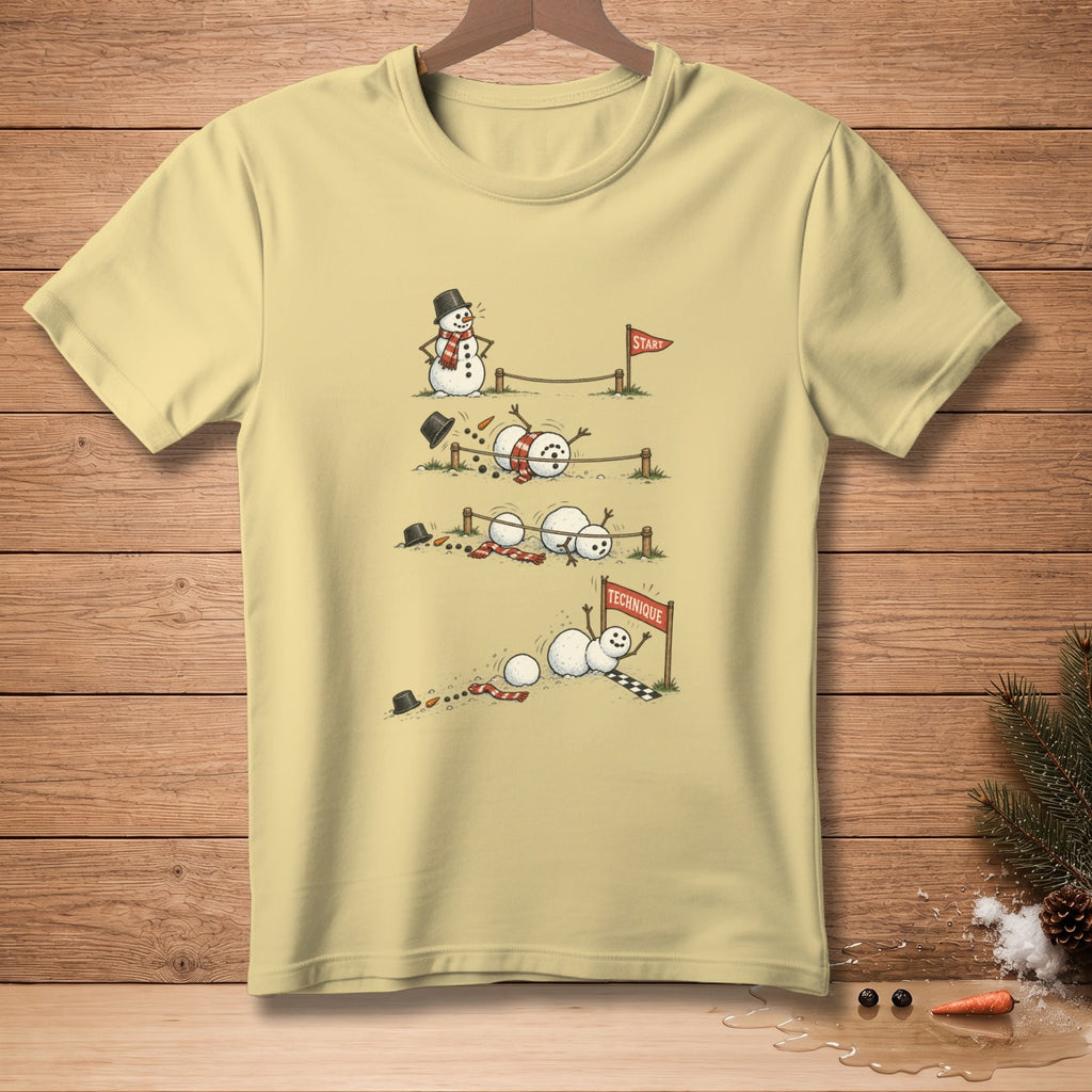 T-shirt graphic shows snowmen struggling in a race with "START" and "TECHNIQUE" signs.