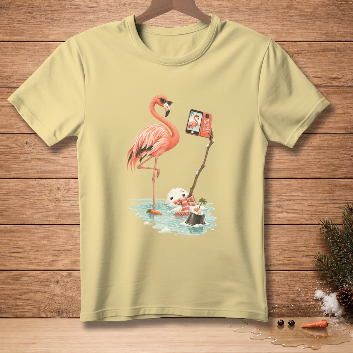 Flamingo taking selfie with melting snowman on a stick, phone says "Got the Shot".