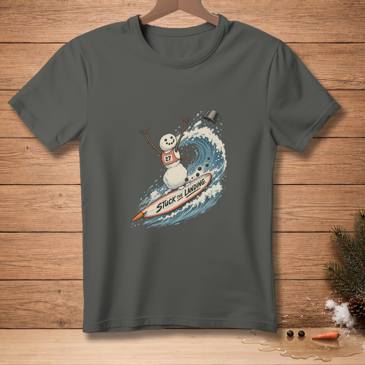 Snowman surfing a wave on a surfboard with text "STUCK THE LANDING".
