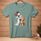Snowman blow-drying a fluffy dog with a red scarf and black hat.