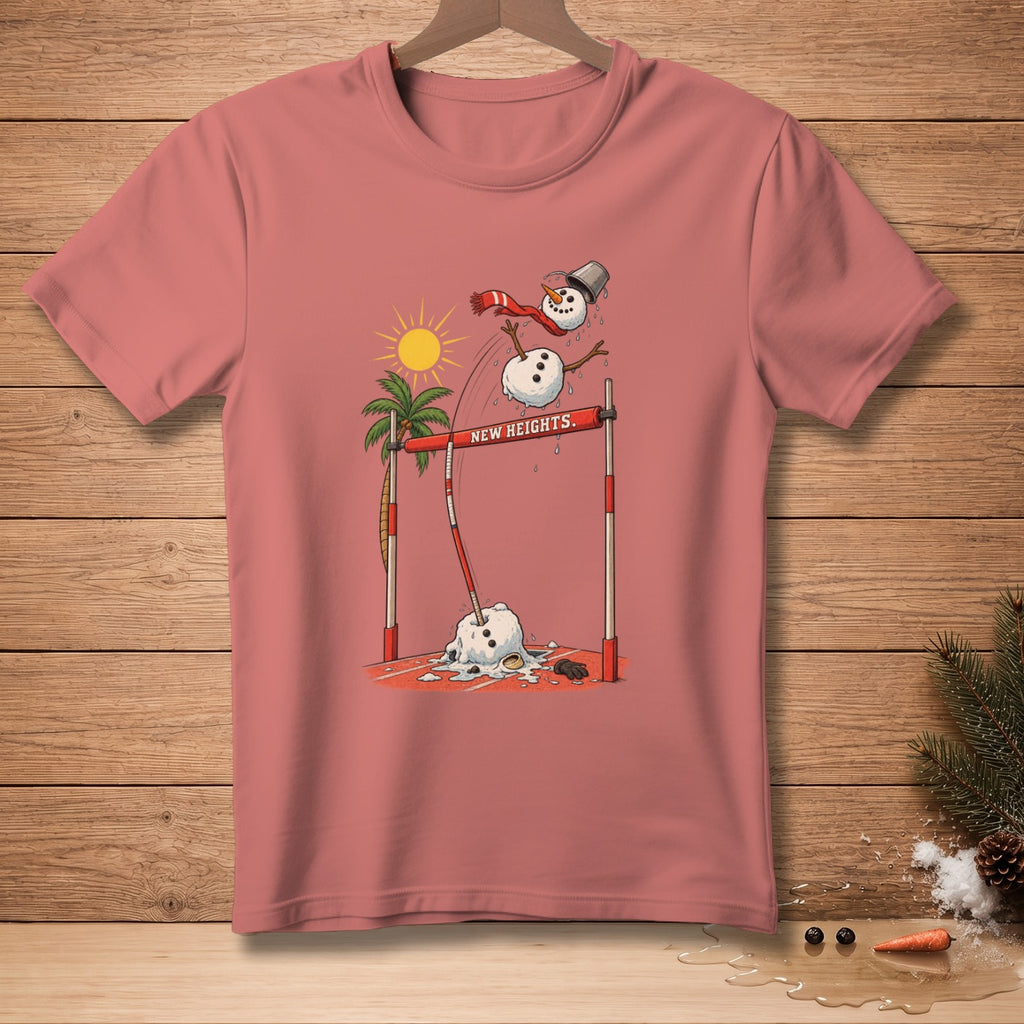 Snowman jumping over a bar labeled "NEW HEIGHTS" on a pink t-shirt.
