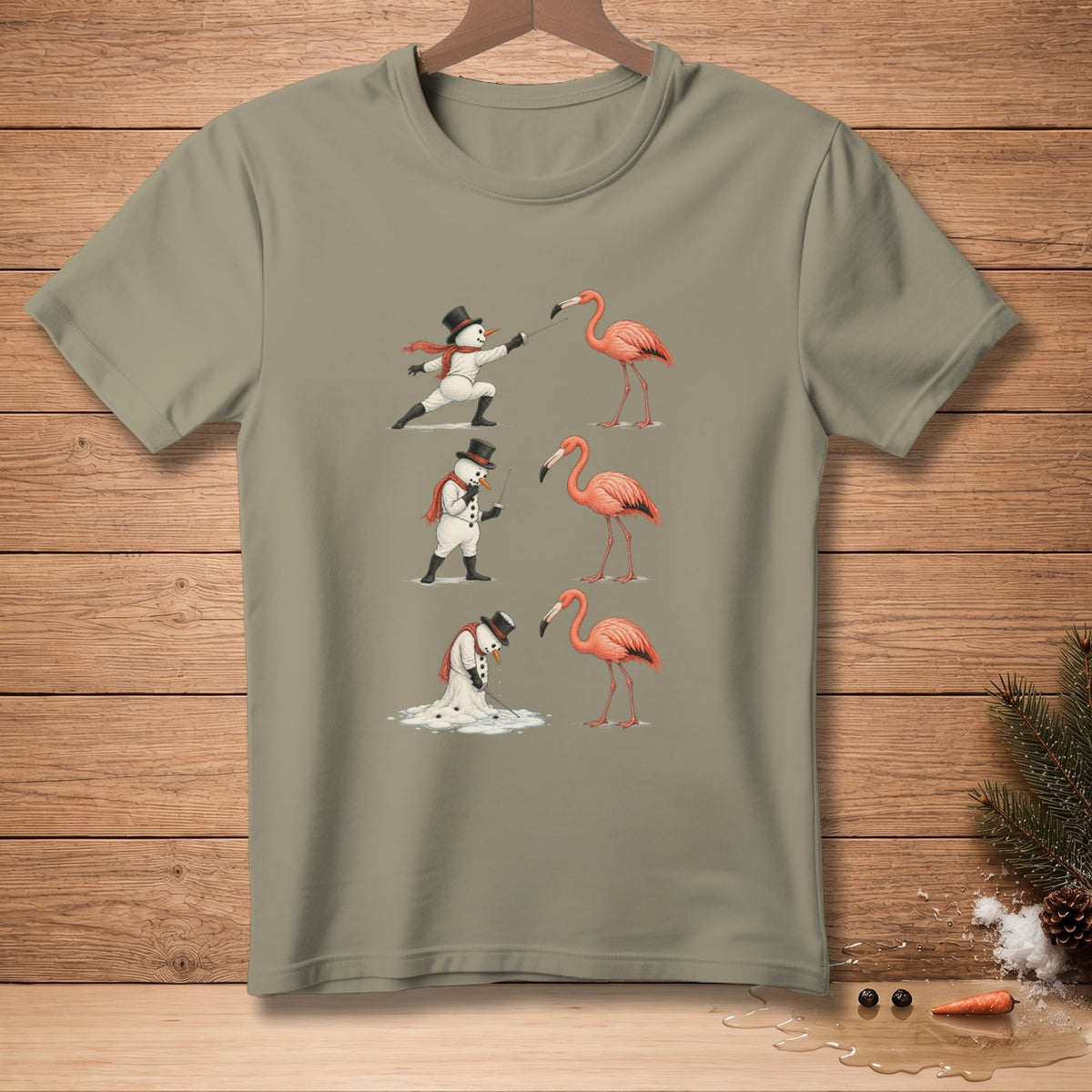 Snowmen fencing flamingos on a taupe t-shirt.