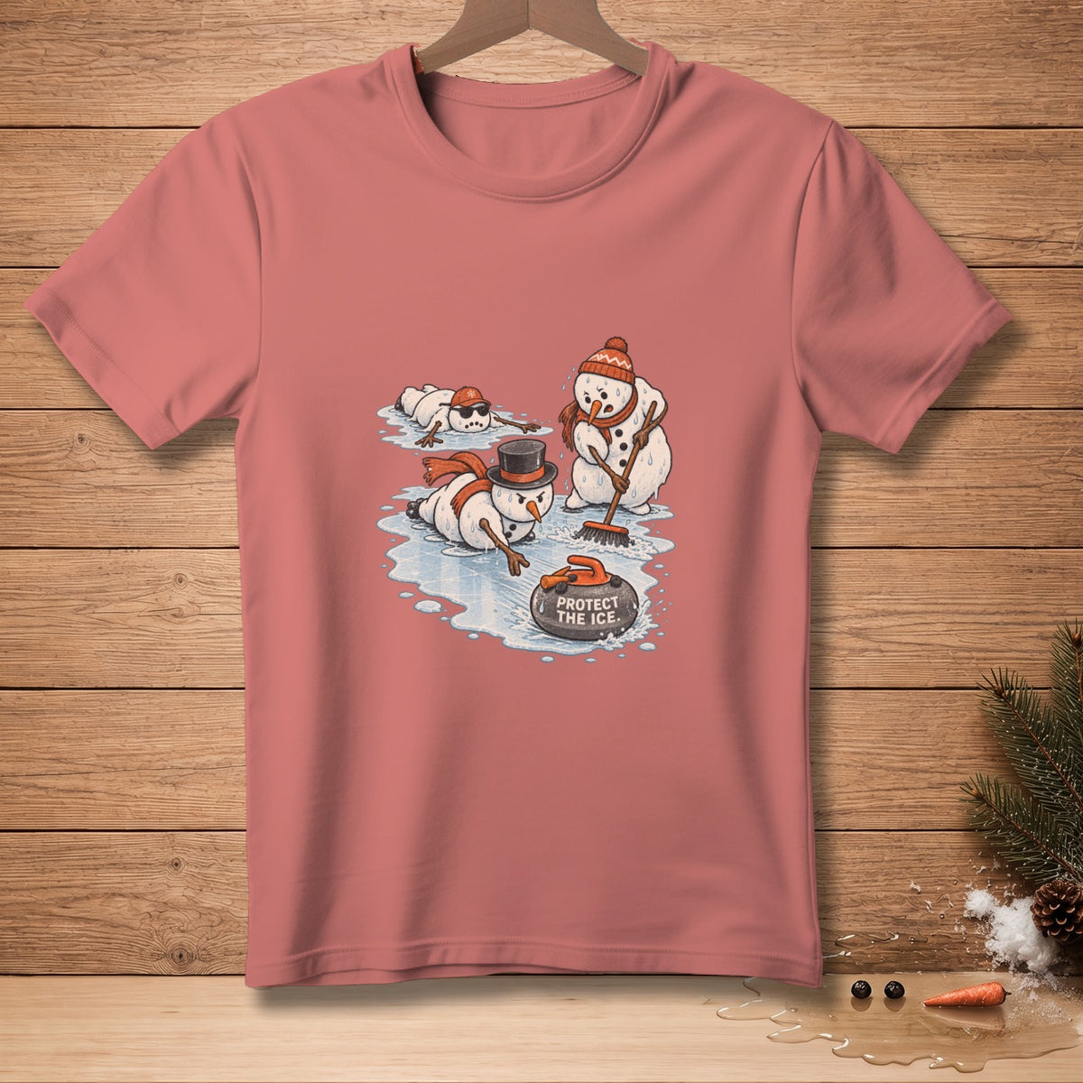 Snowmen play curling with text "PROTECT THE ICE" on a pink t-shirt.
