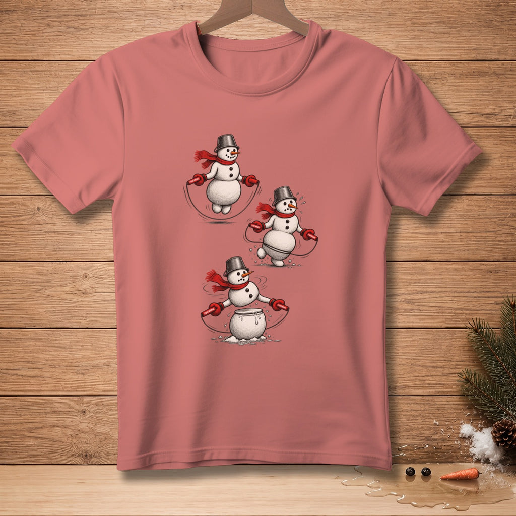 T-shirt with three snowmen jumping rope wearing scarves and bucket hats.