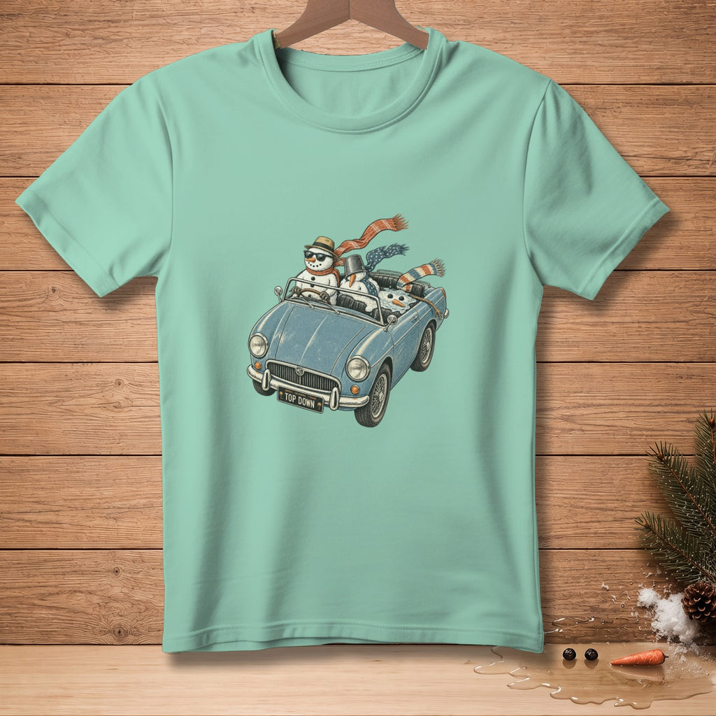 Snowmen wearing scarves and hats drive a blue convertible with "TOP DOWN" license plate.