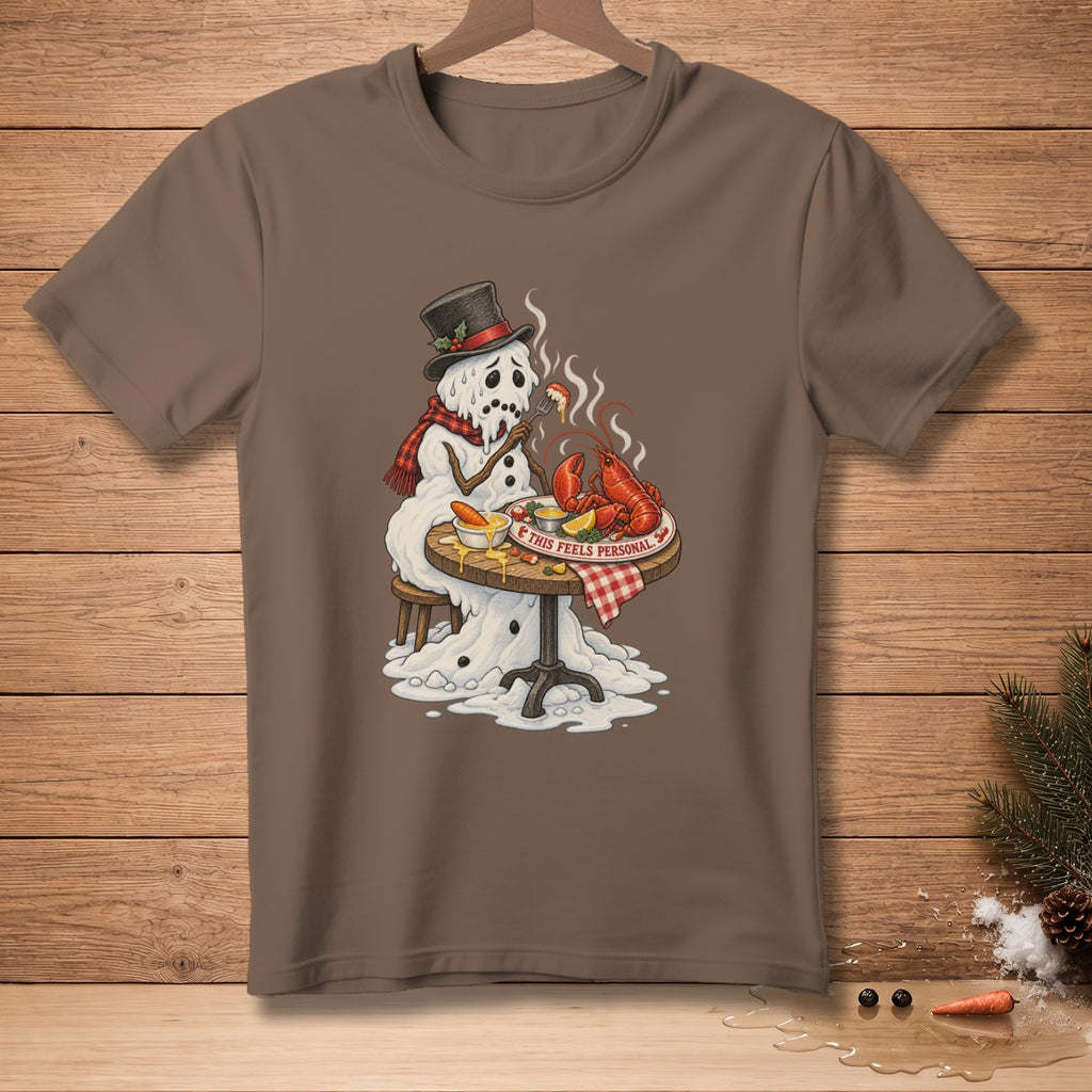 Melting snowman in hat and scarf eats lobster at a table with text "This feels personal."