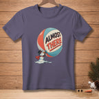 T-shirt graphic of melting snowman holding sphere with text "ALMOST THERE".