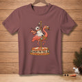 T-shirt with a humorous Christmas graphic of a flamingo with a snowman riding it.