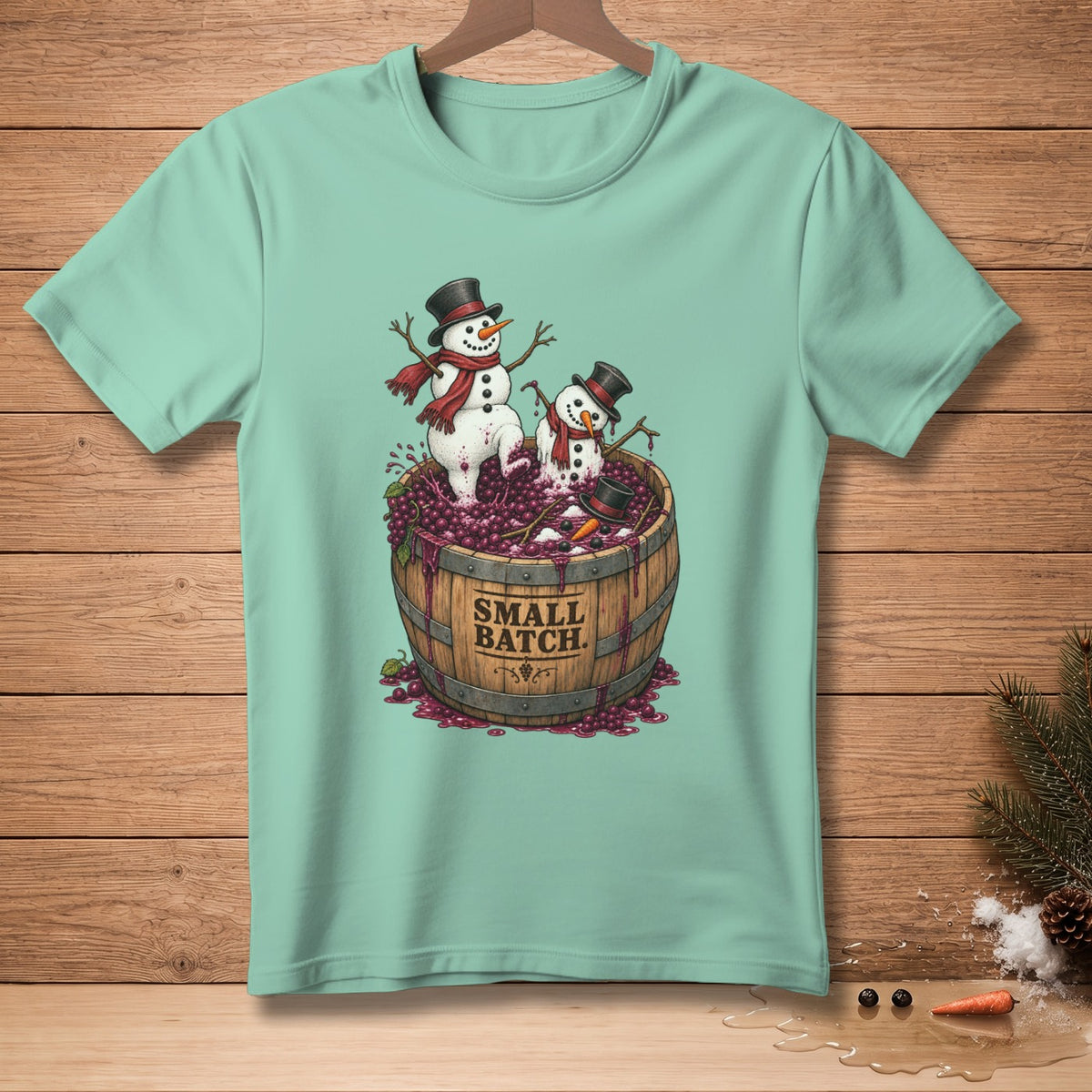 Two snowmen in hats and scarves stand in a barrel of grapes, with "SMALL BATCH" text.