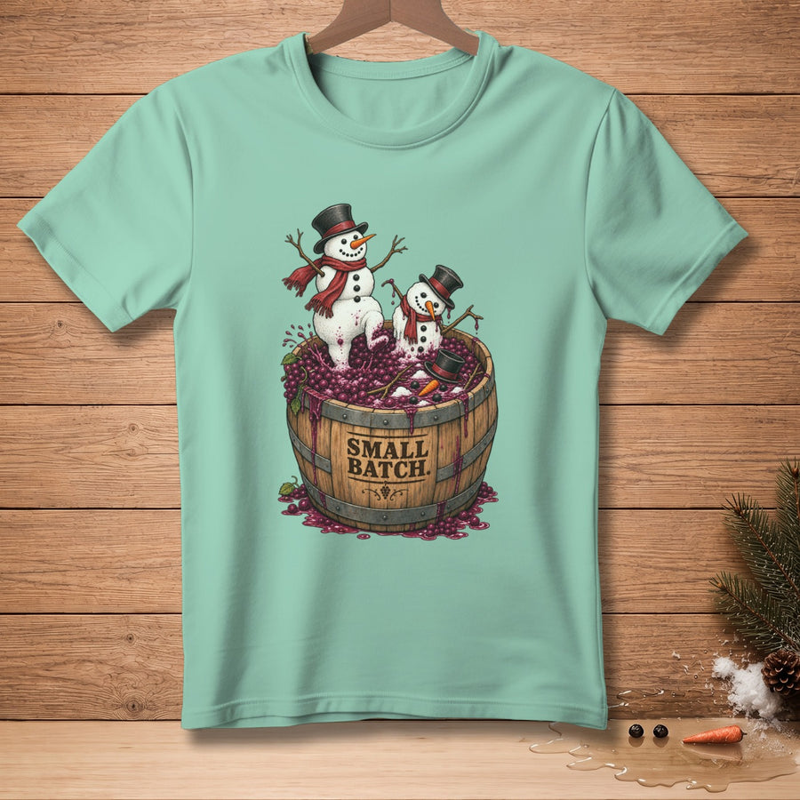 Two snowmen in hats and scarves stand in a barrel of grapes, with "SMALL BATCH" text.