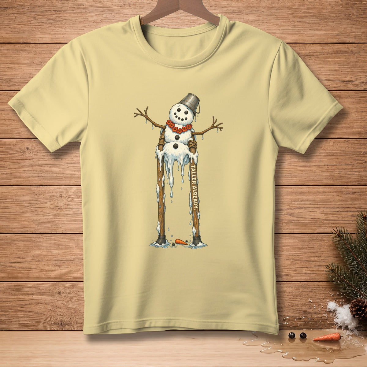 T-shirt with melting snowman illustration and "TALLER ALREADY" text.