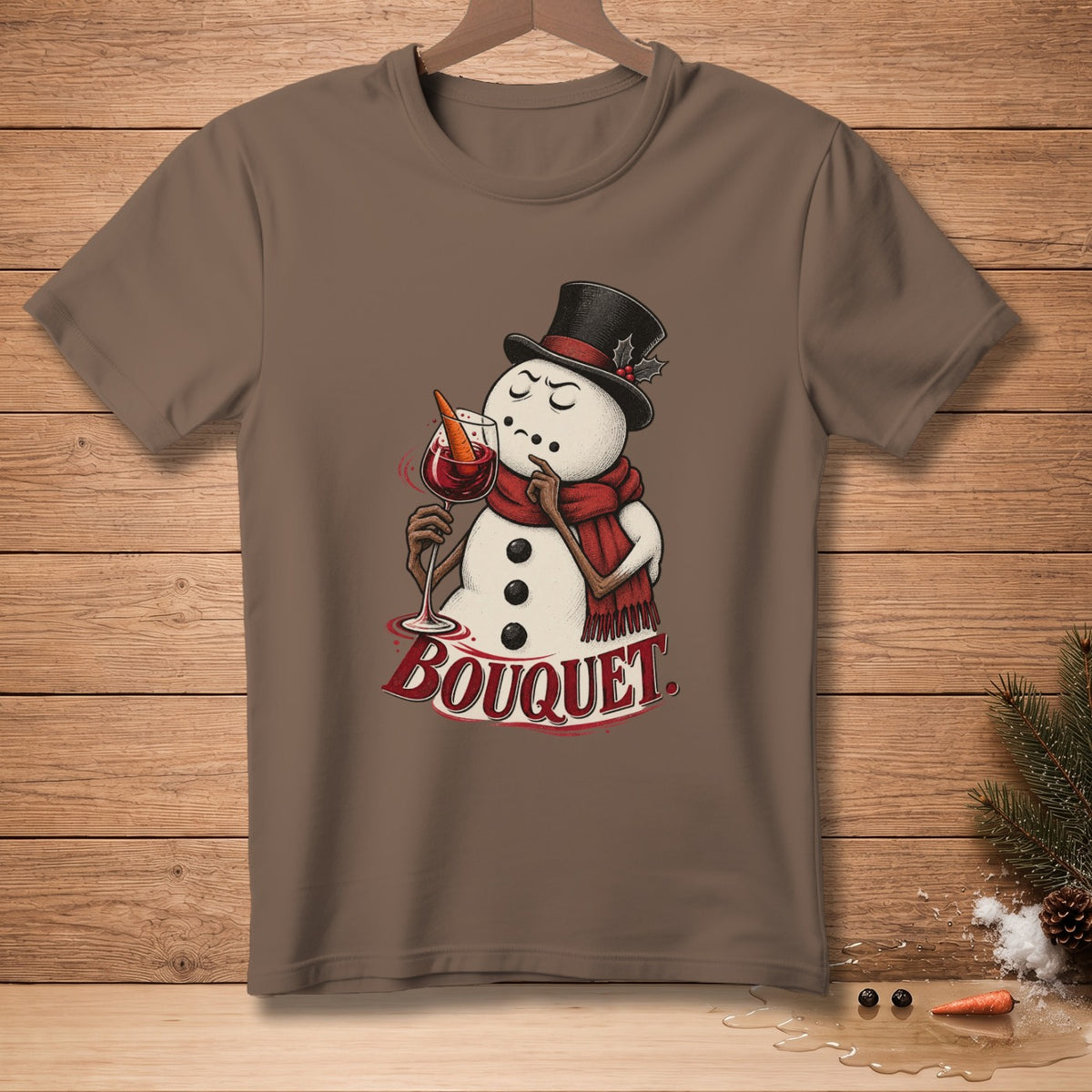 Brown t-shirt featuring a snowman in a top hat and scarf holding a glass of wine with text "BOUQUET."