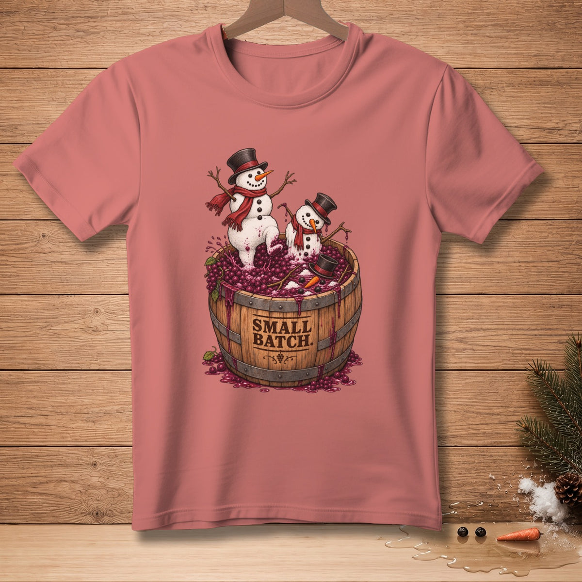 Two snowmen in top hats and scarves stand in a barrel of grapes labeled "SMALL BATCH".