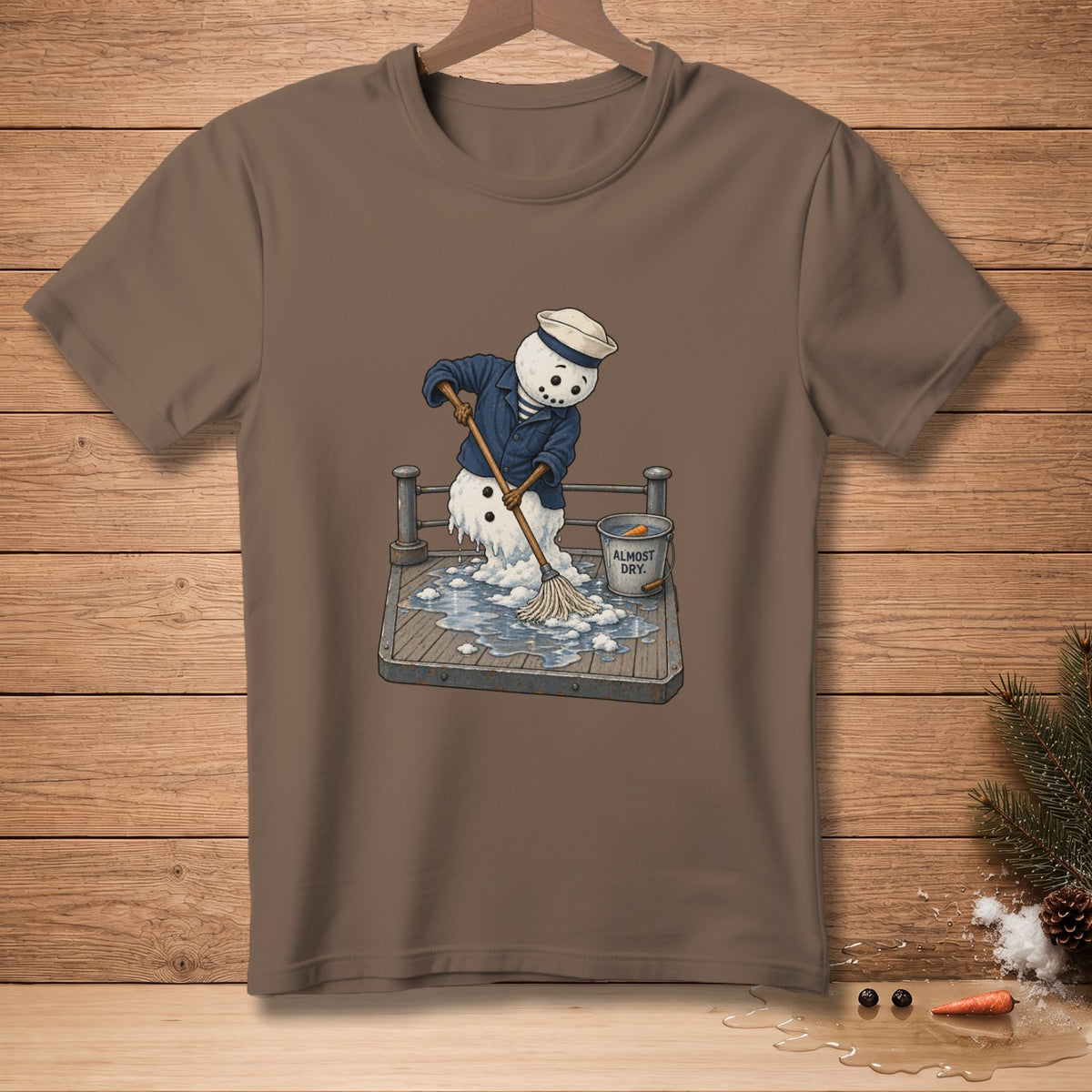 Snowman in sailor outfit mops a wet deck with a bucket labeled "Almost Dry".