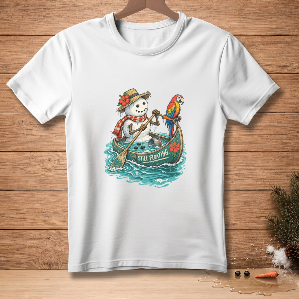 Snowman in a canoe with a parrot, paddling with text "Still Floating".