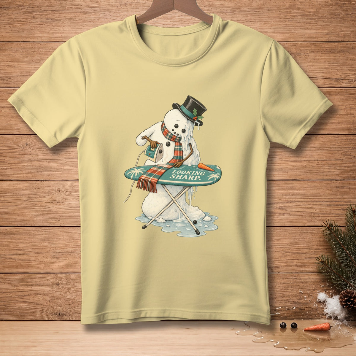 Melting snowman ironing a scarf that says "Looking Sharp".