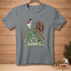 Bigfoot and a snowman play shuffleboard on a t-shirt graphic.
