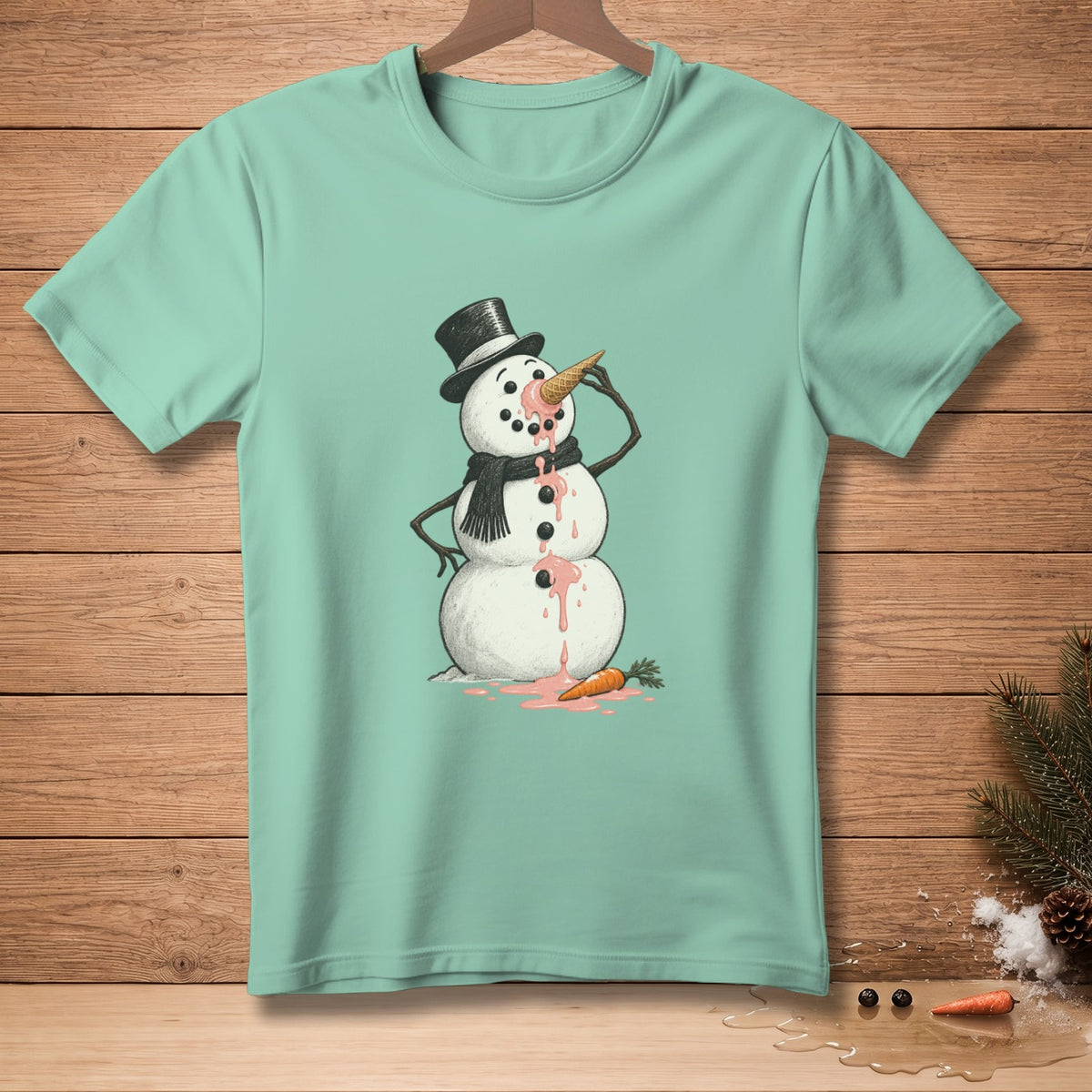 Mint t-shirt with a melting snowman wearing a top hat and scarf holding an ice cream cone.