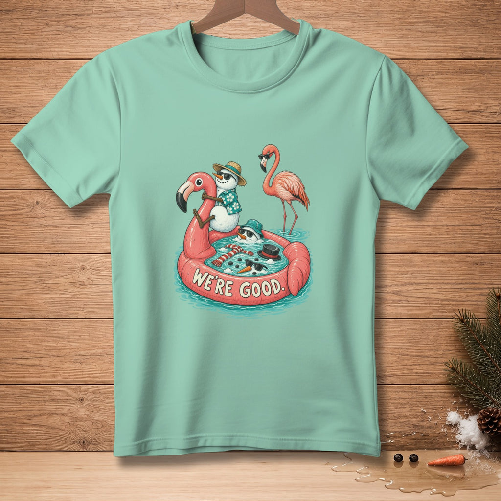 T-shirt with cartoon snowmen and flamingo on float, text "We're Good."