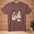 Two snowmen with top hats and martinis sit at a table, while another snowman melts.