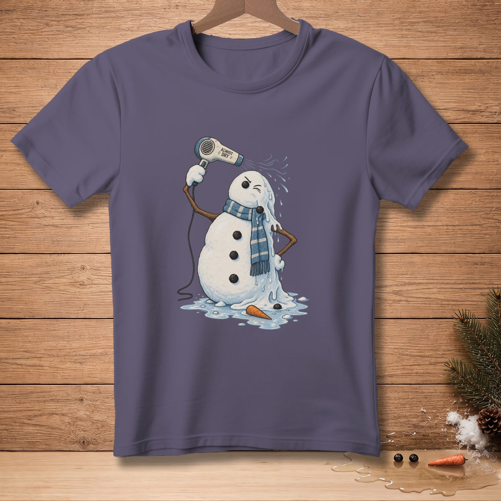 Melting snowman with hairdryer and "ALMOST DRY" text on a purple t-shirt.