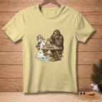 Bigfoot sits at a picnic table with a melting snowman, text reads "BEST TWO OUT OF THREE."