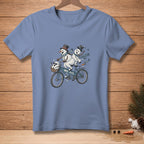 T-shirt with two snowmen riding a tandem bicycle, "We Fit." text.
