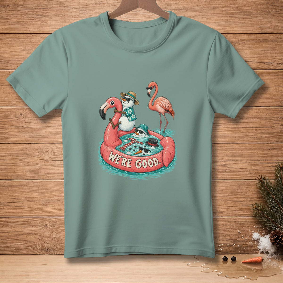 Snowmen on a flamingo float with a flamingo, saying "We're Good."